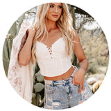 model wearing white corset lace up top with rhinestone fringe shorts. Links to the tops collection