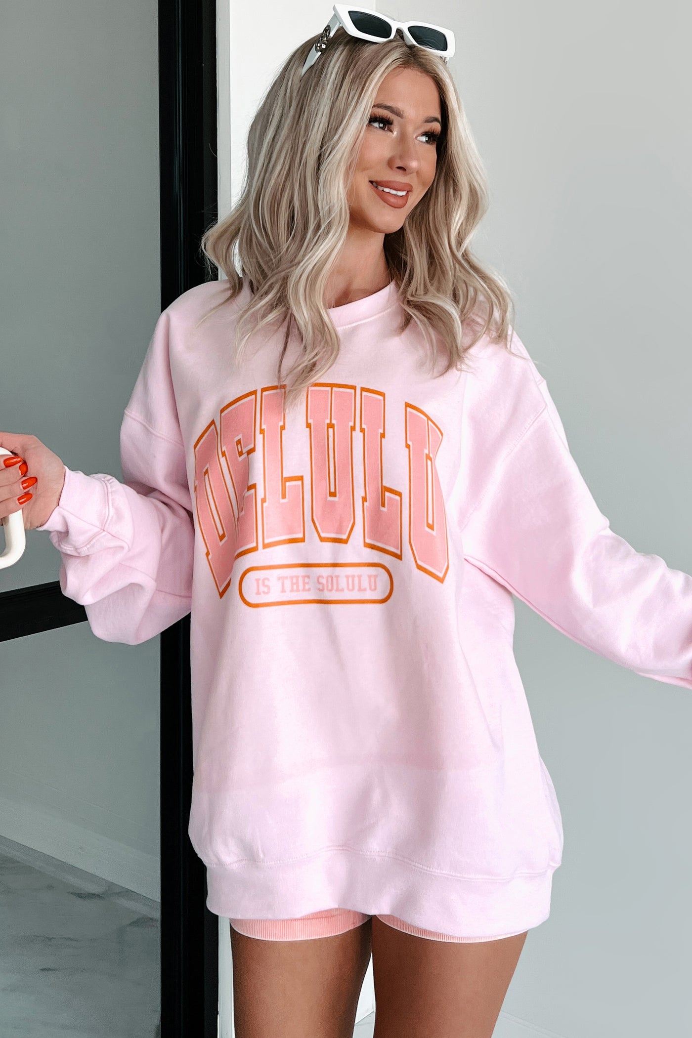 "Delulu Is The Solulu" Graphic Sweatshirt (Light Pink) - NanaMacs