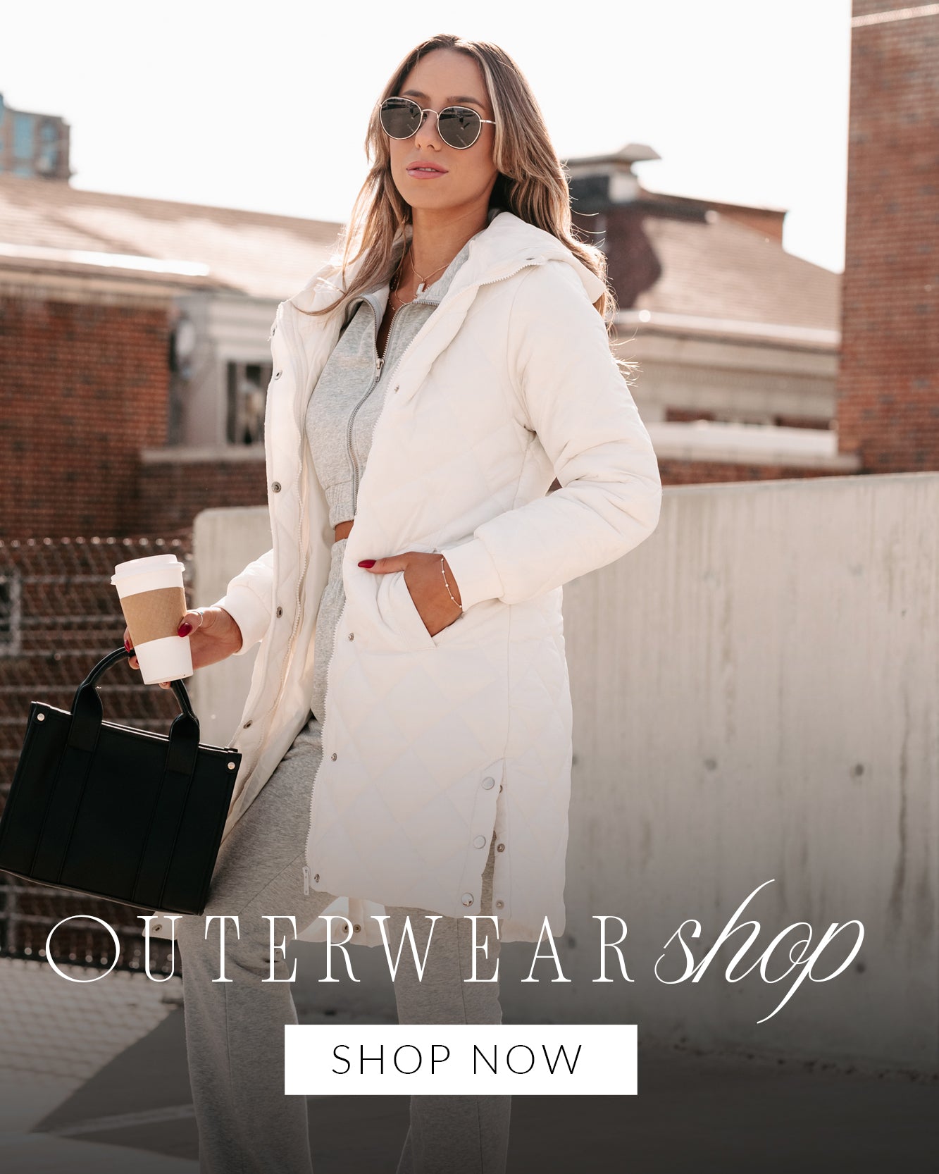 Photo of a model wearing a white puffer coat and grey set. Headline says "Outerwear Shop". Call to Action says "Shop Now" and links to the Outerwear Collection.