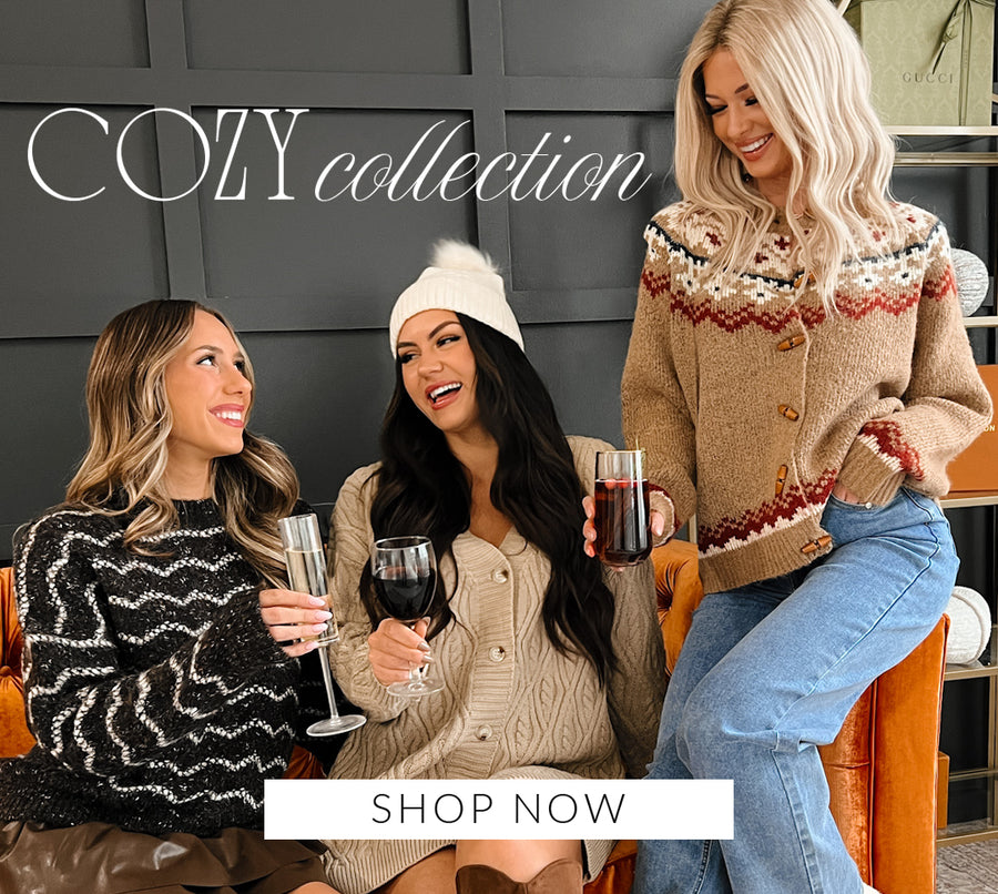 Photo models wearing cozy thanksgiving outfits. Headline says "Cozy Collection" Call to Action says "Shop Now" and links to the Cozy Collection.