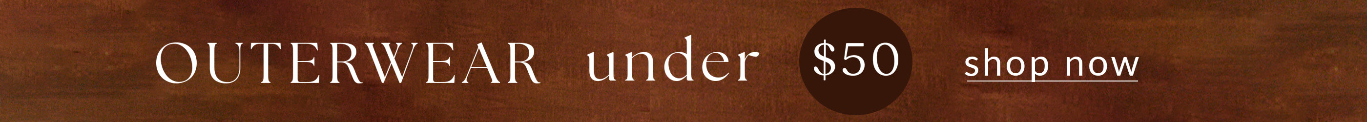 Promotional banner for outerwear under $50 with 'shop now' text on a wooden background.