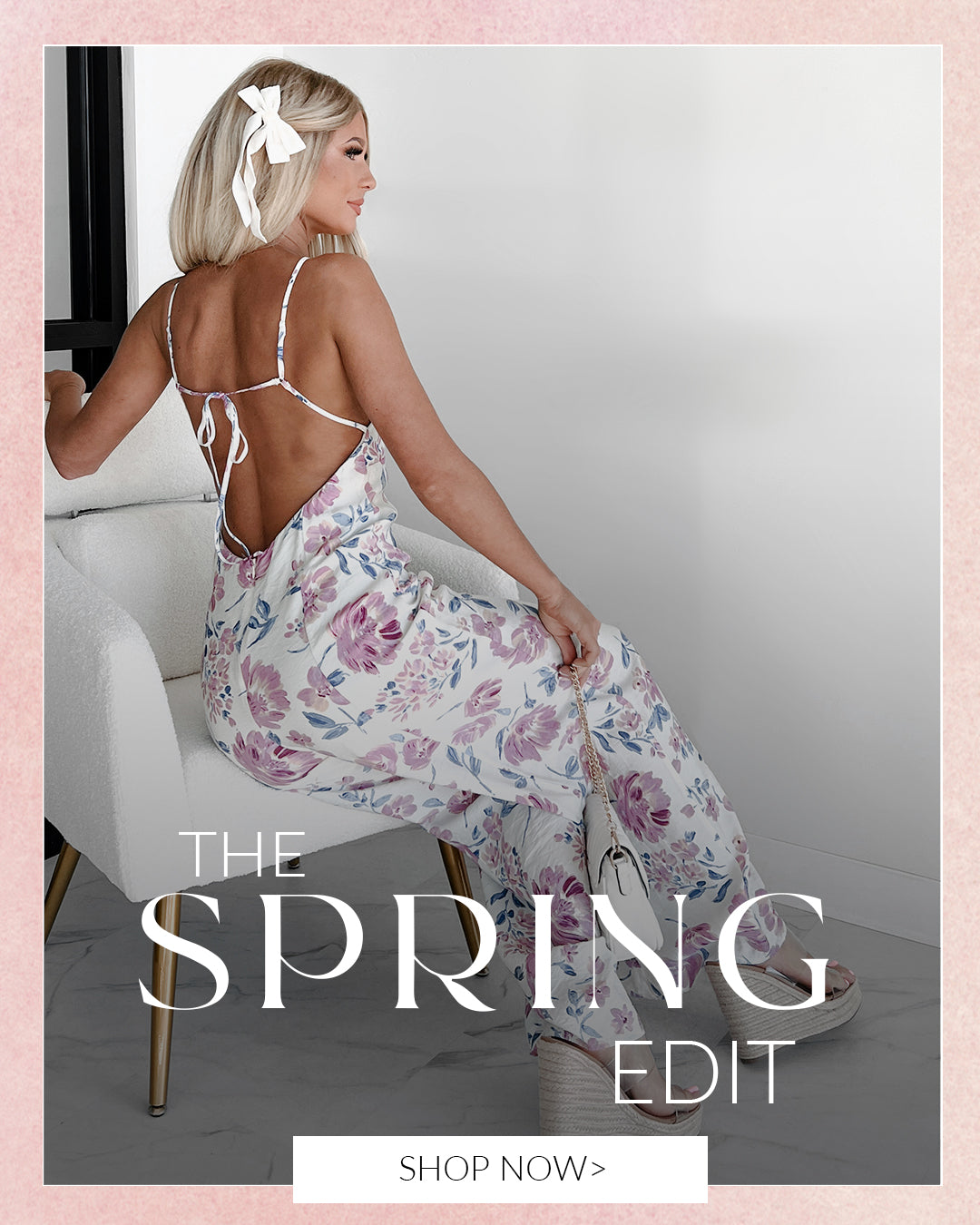 Photo of model wearing an open back jumpsuit, sitting on a chair. "the Spring edit". Call to action says shop now and links to the Spring Collection.