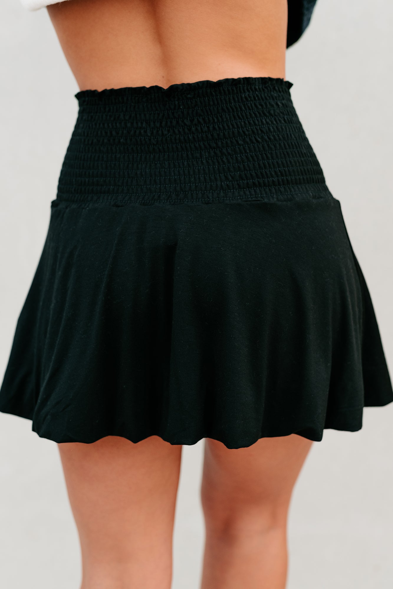 Dial It Back Smocked Waist Bubble Hem Mini Skirt (Black) - NanaMacs