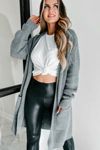 Woman wearing a blanket wrap cardigan with leggings