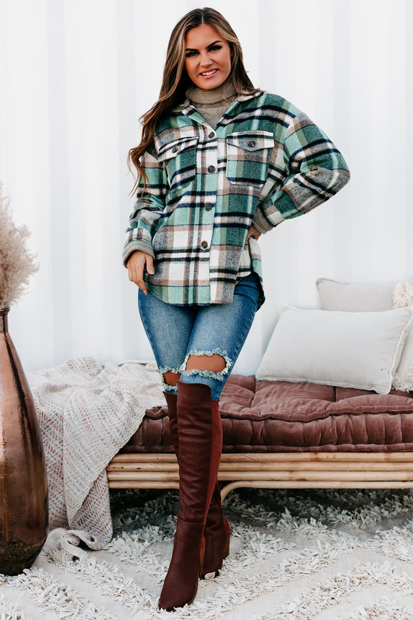 Distressed brown boots with flannel shirt and black jeans